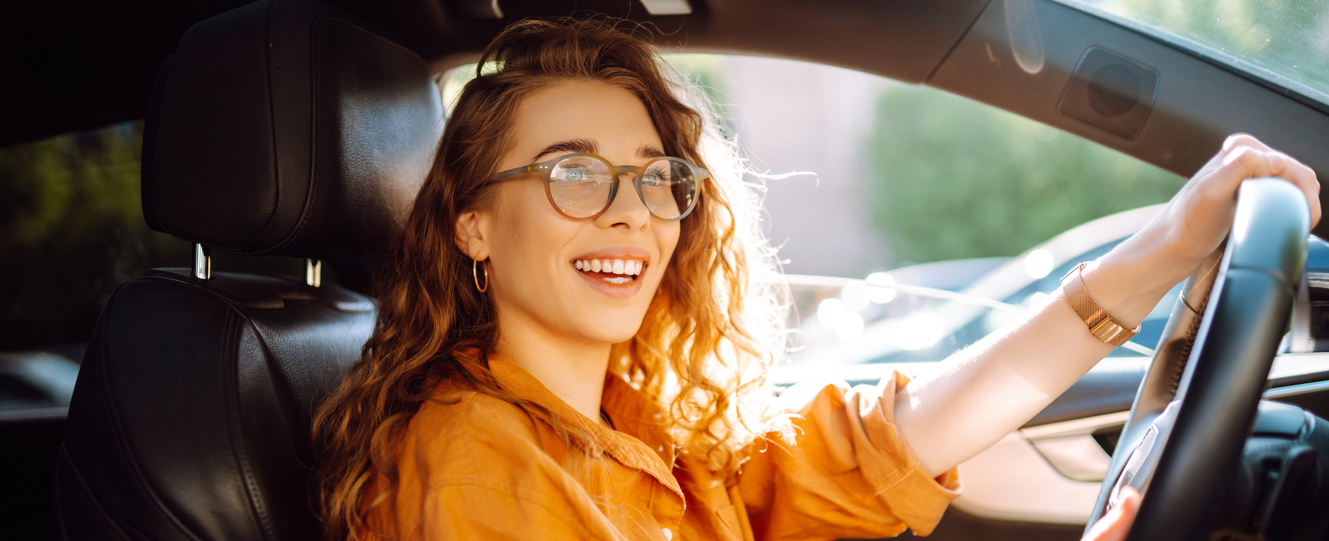 Vehicle insurance - woman driving new car